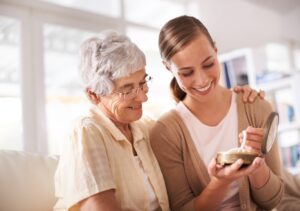 A woman appreciates a gift of pearls from her mother