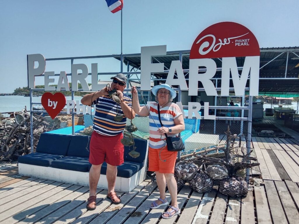 An elderly couple having fun at the pearl farm tour