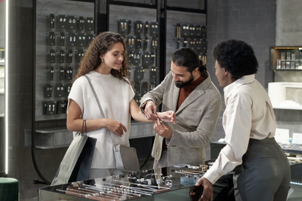 A man checking the bracelet size on his wife
