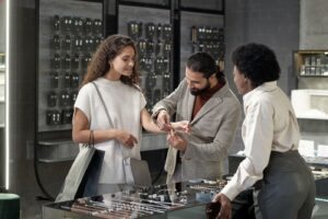 A man checking the bracelet size on his wife