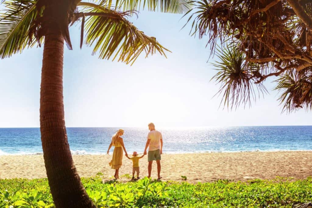 A family walking on a beach in Phuket
