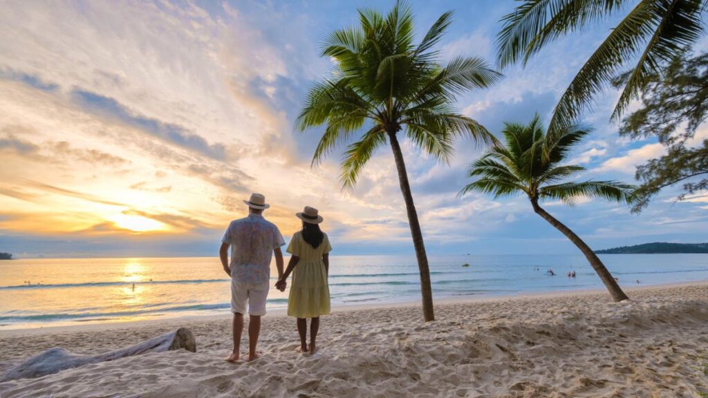 A couple having a romantic walk on the beach