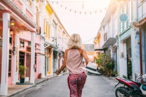 A woman discovering the colorful streets of old Phuket town - a popular Phuket instagram spot