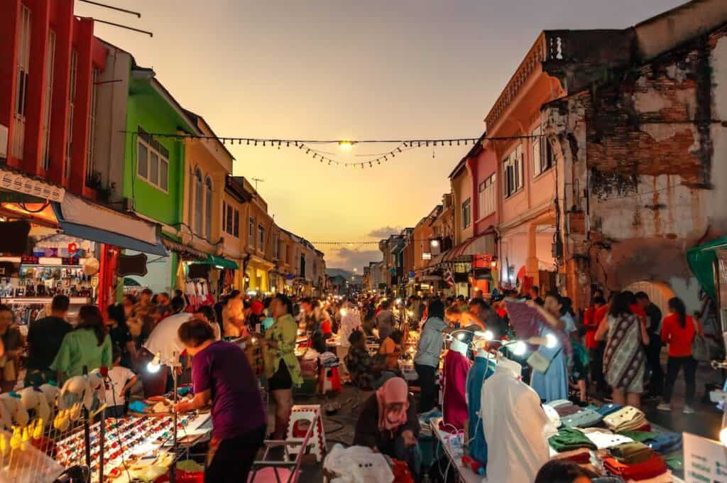 Street stalls and people at the Sunday night market in Old Town Phuket