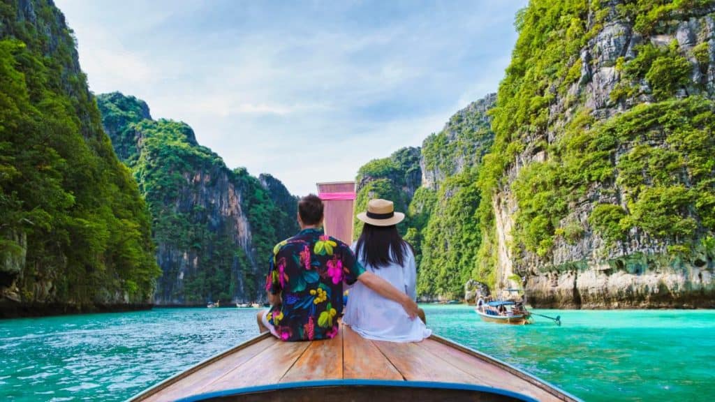 A Couple enjoys scenic views on a boat tour near the best viewpoints in Phuket