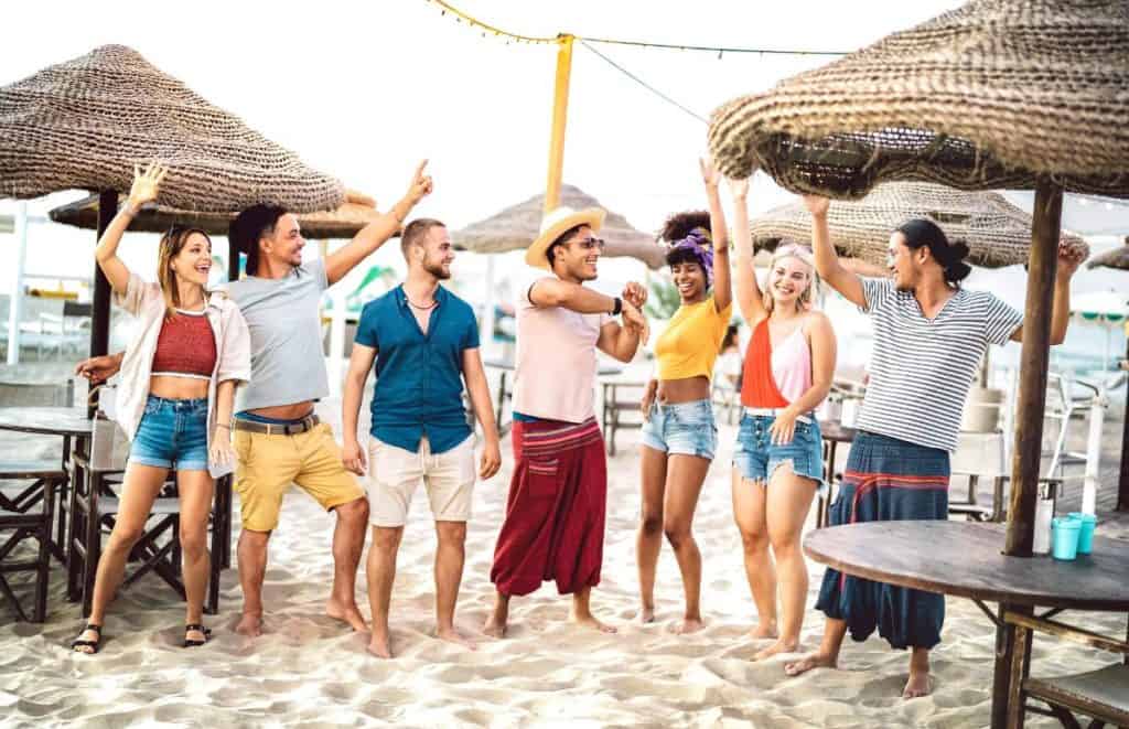 A group of friends having fun at a beach club day in Phuket